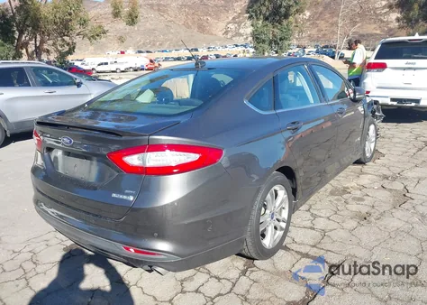2016 Ford Fusion Hybrid Se z USA, uszkodzony, nr VIN 3FA6P0LU9GR398815